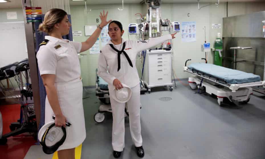 Crew members aboard the USNS comfort navy hospital ship work upon their arrival in Panama on 9 November. 