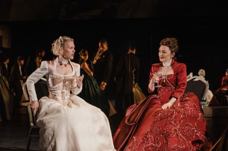 Cécile de Volanges and Marquise de Merteuil talk and laugh together, while seated
