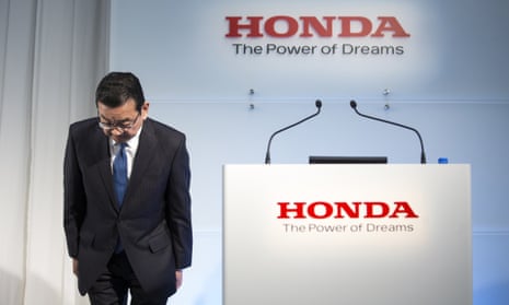 Takahiro Hachigo, president of Honda, bows before a press conference in Tokyo on Tuesday.