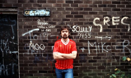 Alan Bleasdale in 1980s, in front of graffiti-covered wall