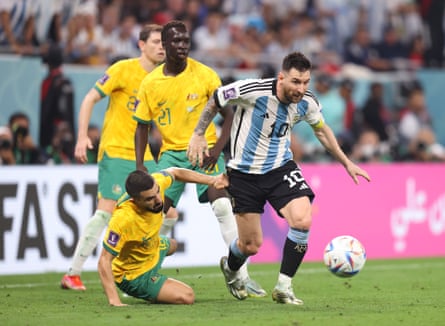 Lionel Messi of Argentina leaves three Australian defenders trailing.