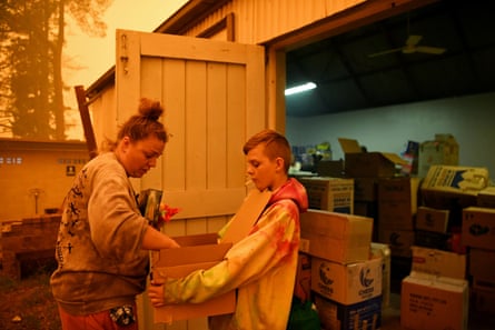 Jesse Collins organises the donations at the evacuation centre in Cobargo, NSW, on 5 January.