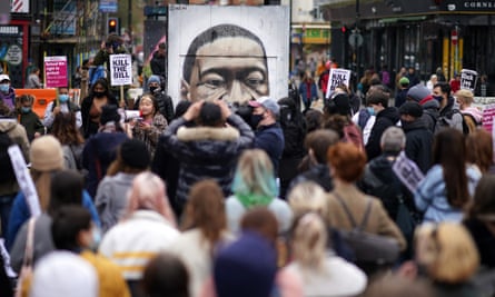 A protest in Manchester against the police, crime, sentencing and courts bill, featuring a George Floyd mural, March 2021.