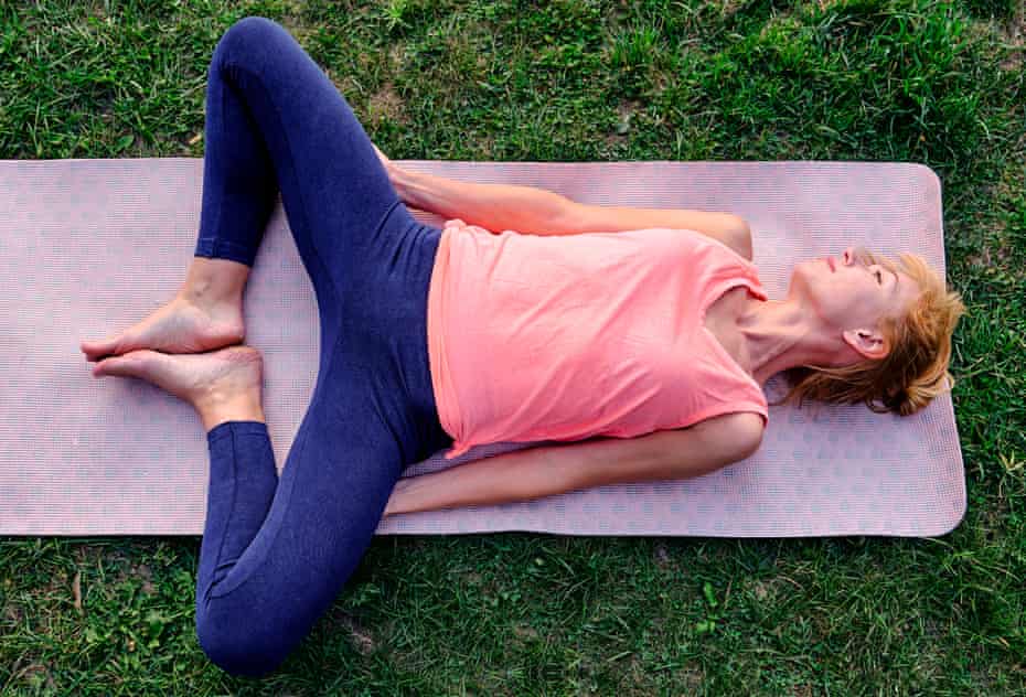 A woman doing a pelvic stretching exercise