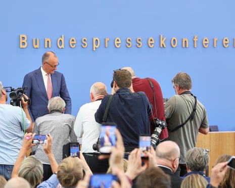 Chancellor Friedrich Merz arrives for his summer press conference in Berlin.