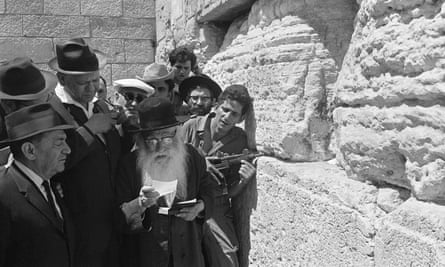 Israeli soldiers and Orthodox Jews pray at the Western Wall in Jerusalem after capturing the eastern part of the city in the six-day war, 1967.