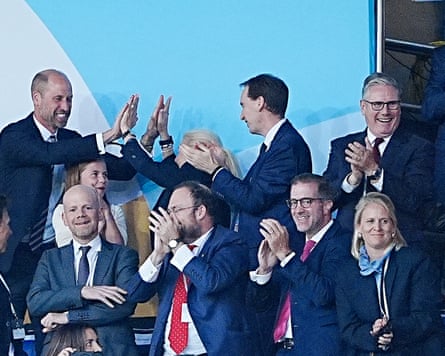 Prince William high-fives a companion arsenic Keir Starmer applauds and smiles successful nan royal box