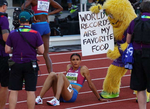 Gold medallist Sydney McLaughlin recovers alongside official mascot Legend the Bigfoot.