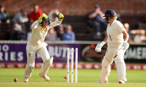 Alyssa Healy of Australia (left) celebrates as Katherine Brunt of England is bowled.