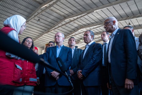 Palestinian prime minister Mohammad Mustafa (centre-left) and Egyptian foreign minister Badr Abdelatty (centre-right) inspect the aid warehouses in Al-Arish on 18 August, 2025 in Arish, Egypt. Mustafa is on an official trip to Egypt, where he is visiting the Egyptian side of the Rafah border crossing into Gaza, alongside Egyptian foreign minister Badr Abdelatty. The pair are also scheduled to visit a field hospital.