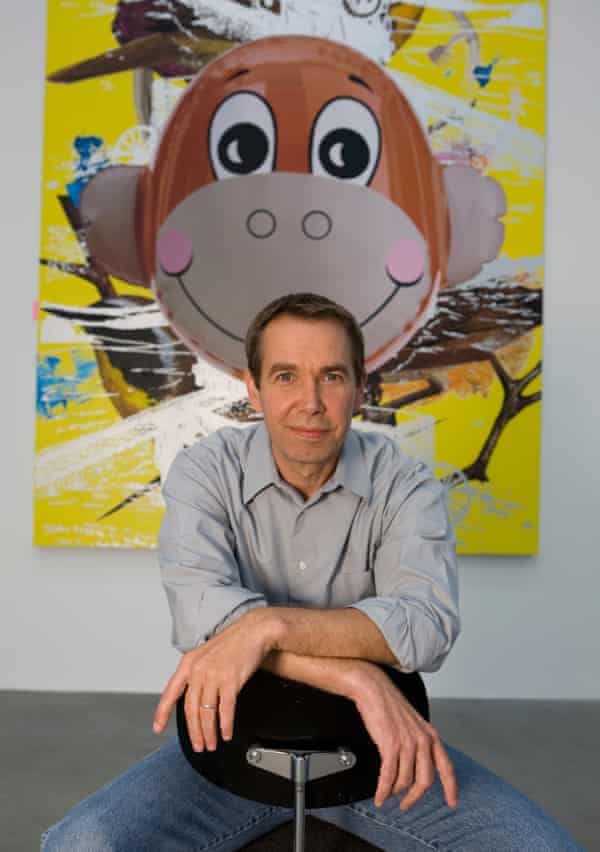 Jeff Koons alongside one of his works of art.
