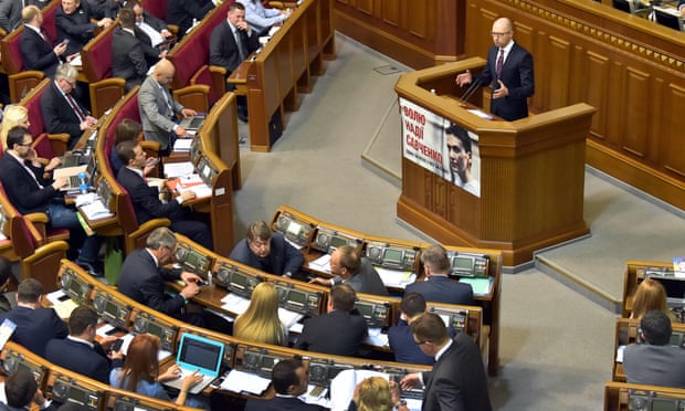 Ukrainian prime minister Arseniy Yatsenyuk addressing parliament on Tuesday, where he survived a vote of no-confidence