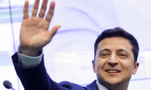 Volodymyr Zelenskiy greets supporters at his headquarters.