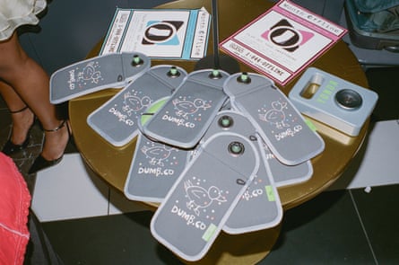 locked phone pouches with dumb.co branding on them