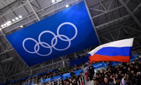 A spectator waves the Russian flag during the ice hockey match between the Olympic Athletes from Russia and Slovenia at Pyeongchang 2018.