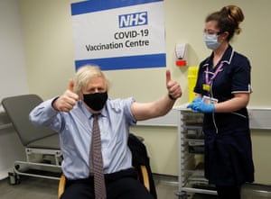 Johnson giving a double thumbs up at vaccination centre