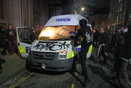 A police van set on fire by protesters outside Bridewell police station in Bristol on 21 March 2021.