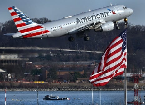 Flights take off over crash site of an American Airlines plane and an Army Black Hawk helicopter that collided and crashed into the Potomac River near Reagan National Airport in Arlington VA on January 30, 2025.