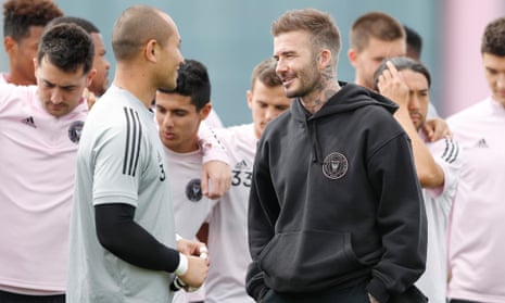 David Beckham talks with Inter Miami captain Luis Robles as the team prepare for their MLS debut