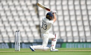 Wood defends his wicket.