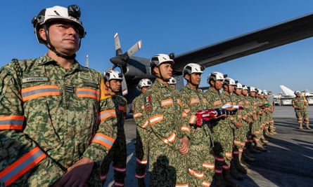 A team of firefighters sent by Mexico to California to help teams battling the raging wildfires arrive in Los Angeles, California, on Saturday.