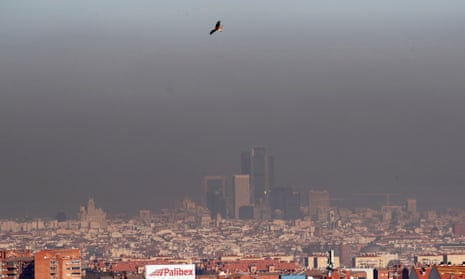 The skyline of downtown Madrid seen through smog