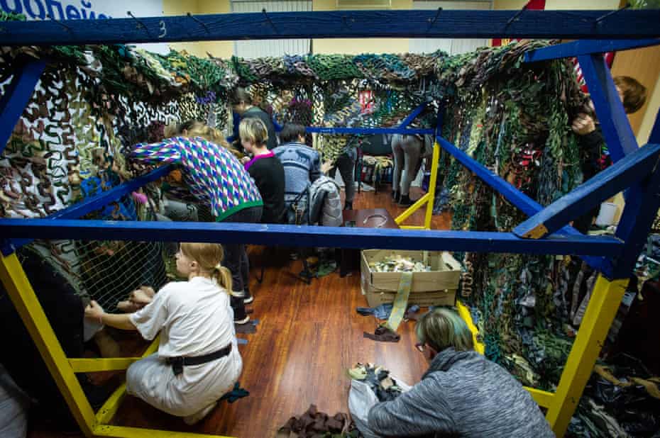 Ukrainian civilians weave camouflage netting