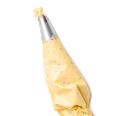 Felicity Cloake’s devilled eggs 07c. The piping bag. Using a small spoon, divide the egg-yolk mayo between the hollowed-out egg whites or, if you’re feeling very fancy, pipe it in using a bag and a star-shaped nozzle. Arrange on a plate, dust with cayenne pepper and serve.