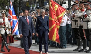 Theresa May and the Macedonian prime minister, Zoran Zaev, inspect an honour guard during a welcome ceremony in front of the Government Building in Skopje.