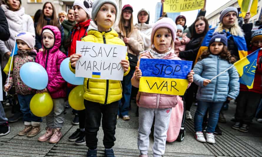 Russia-Ukraine war: 120,000 civilians blocked from leaving besieged city of Mariupol, says Zelenskiy – live 1 Young protesters at the European Parliament building in Warsaw, Poland, on Thursday.