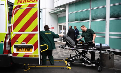 NHS ambulance workers outside a hospital