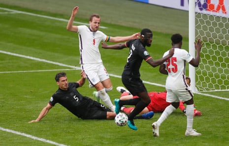 Germany’s Mats Hummels tackles Kane and gets the ball clear.