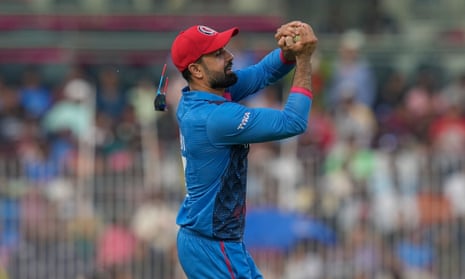 Afghanistan's Mohammad Nabi takes a catch to dismiss Pakistan's captain Babar Azam.