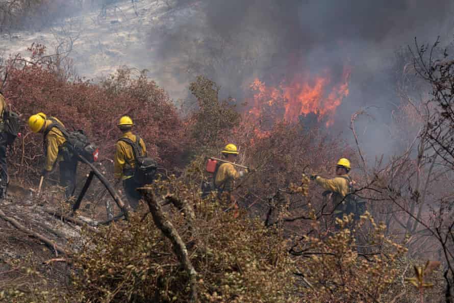 Firefighters battle the Chaparral fire burning in San Diego and Riverside counties.