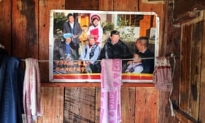 Posters of Xi Jinping have been plastered on nearly all new homes in Padangshang.