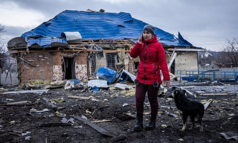 A woman on her phone at the scene of the Russian rocket strike on Kramatorsk’s outskirts
