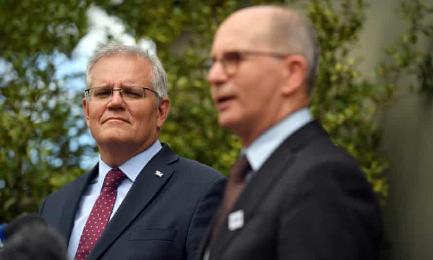 Scott Morrison watches on as chief medical officer Paul Kelly speaks at Kirribilli House in Sydney