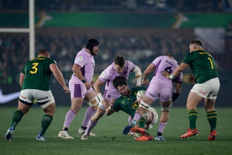 South Africa's lock Ruan Nortje is challenged by Scotland's flanker Matt Fagerson.