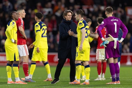 Thomas Frank consoles his players after their dismal defeat at Nottingham Forest