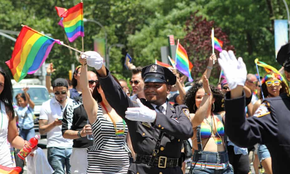An NYPD officer takes part in the 2014 Pride march