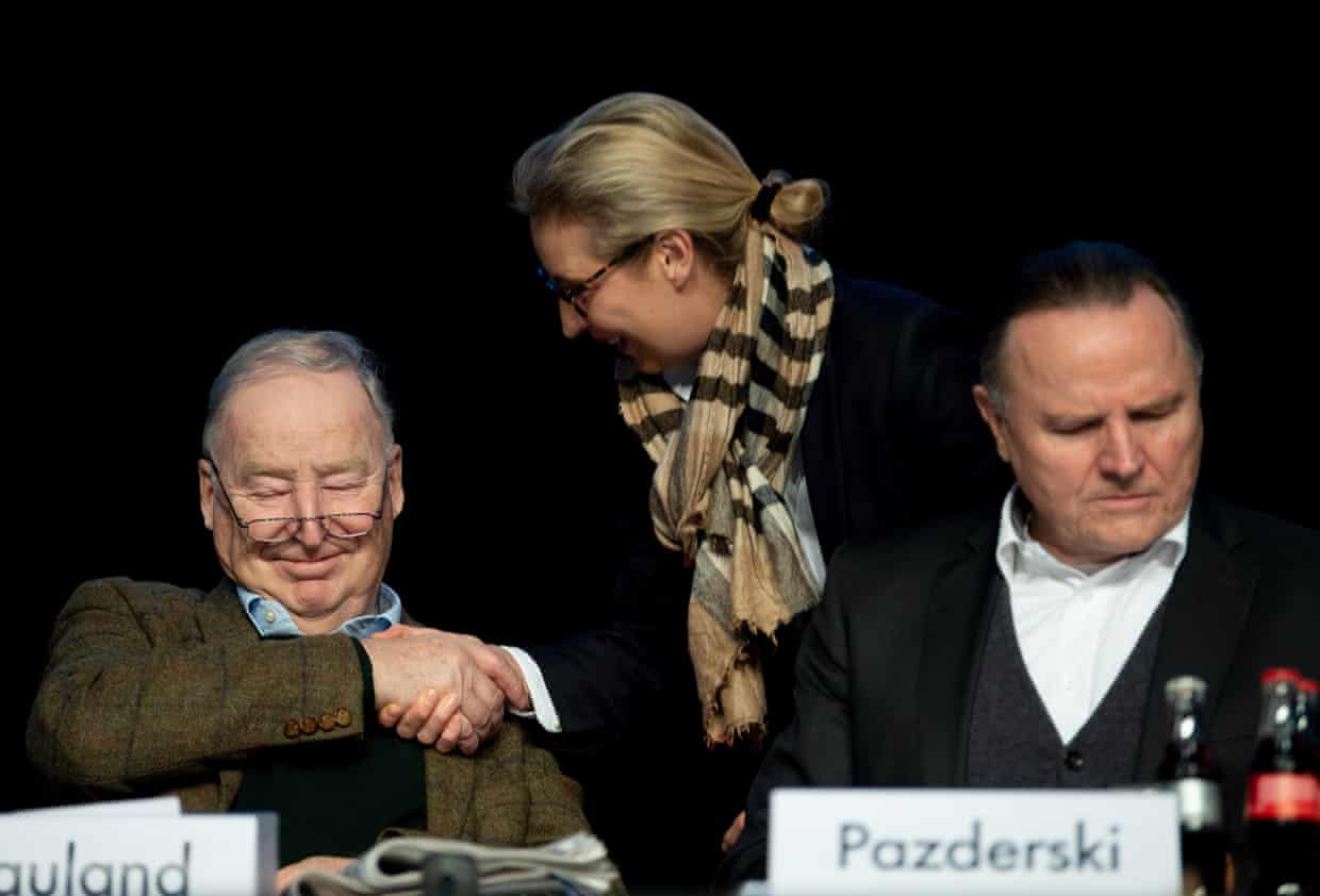 Gauland smiles while shaking hands with AfD’s Alice Weidel, as Pazderski looks down nearby