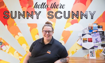 Charlotte Bumpton-Childs of the GMB sitting at a desk under a sign that reads ‘hello there sunny Scunny’