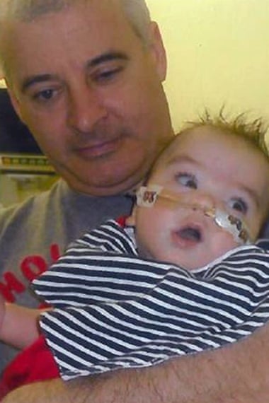 Kevin McGuigan with his grandson Ollie in hospital in 2011.