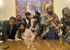 Taliban fighters take control of the Afghan presidential palace on Sunday evening