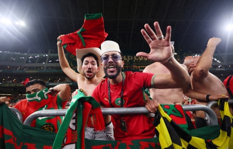 Morocco fans celebrate after the match as Morocco qualify for the round of 16 stage.