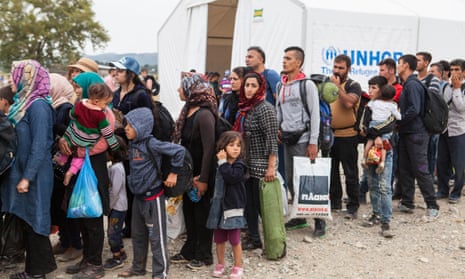 Refugees line up at the UNHCR registration centre in Gevgeliya, Macedonia