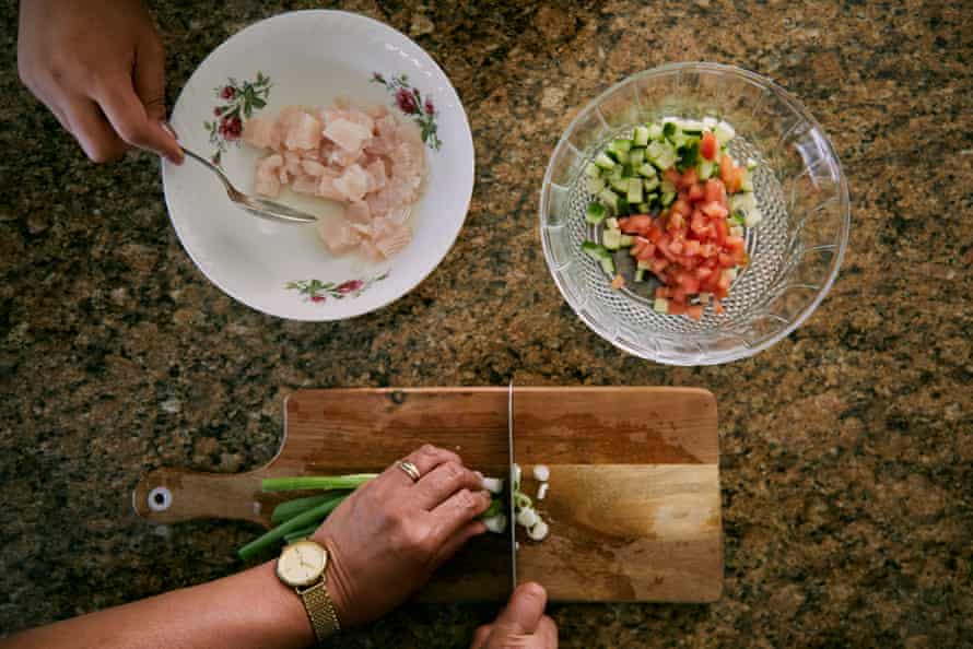 Fresh white fish fillet is cleaned, cut into bite-size pieces then briefly marinated in fresh lemon juice.  It's combined with finely diced vegetables – spring onion, cucumber, tomato and capsicum