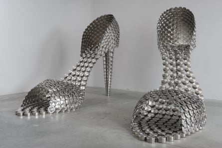 Lifesize sculpture of two stilettos made of metal pans