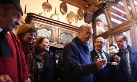Alain Juppé tries an omelette during a visit to Mont Saint-Michel in October 2015