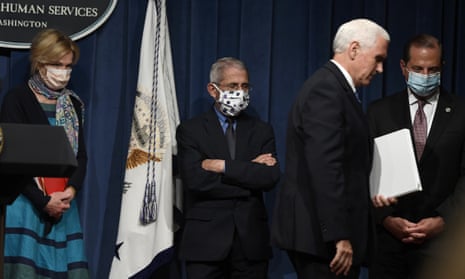 US Vice President Mike Pence, second from right, walks off of the stage following the conclusion of a briefing with the Coronavirus Task Force at the Department of Health and Human Services in Washington on 26 June, 2020.